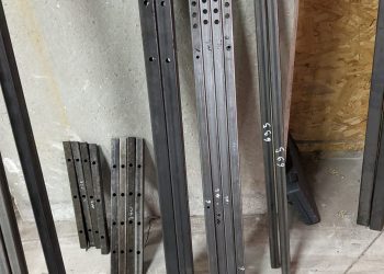 Steel profiles after cutting, drilling and insertion of rivnuts.