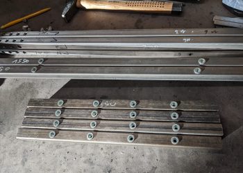 Steel profiles after cutting, drilling and insertion of rivnuts.